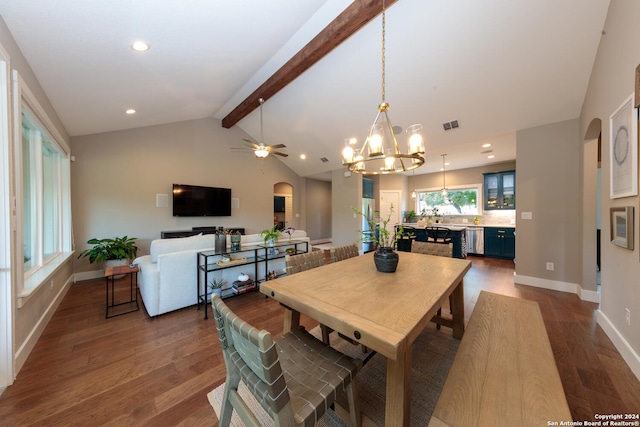 dining room featuring ceiling fan with notable chandelier, vaulted ceiling with beams, and hardwood / wood-style floors