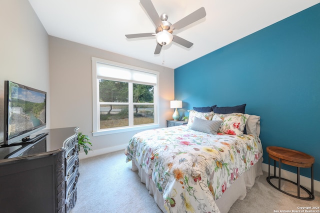 carpeted bedroom featuring ceiling fan