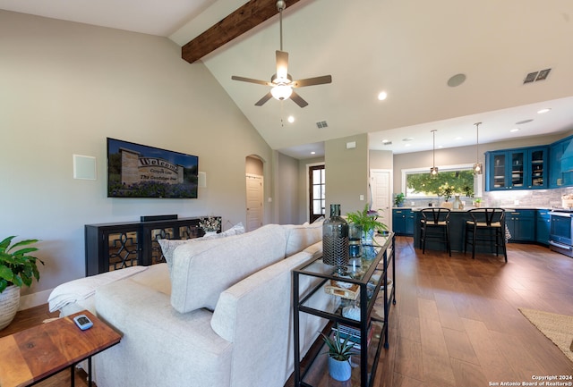 living room with high vaulted ceiling, beamed ceiling, ceiling fan, and dark hardwood / wood-style floors