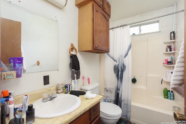 full bathroom featuring shower / bathtub combination with curtain, vanity, and toilet