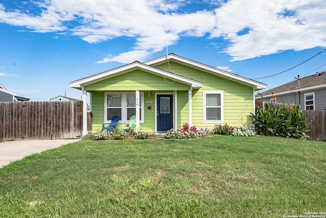 bungalow-style home featuring a front yard