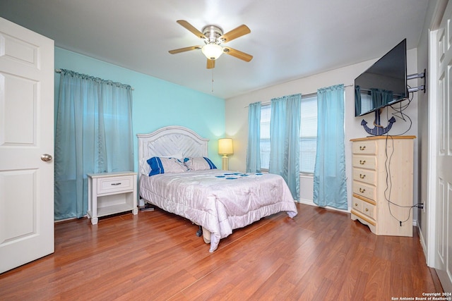 bedroom featuring wood-type flooring and ceiling fan