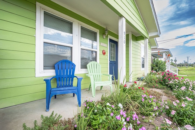 view of exterior entry featuring a porch