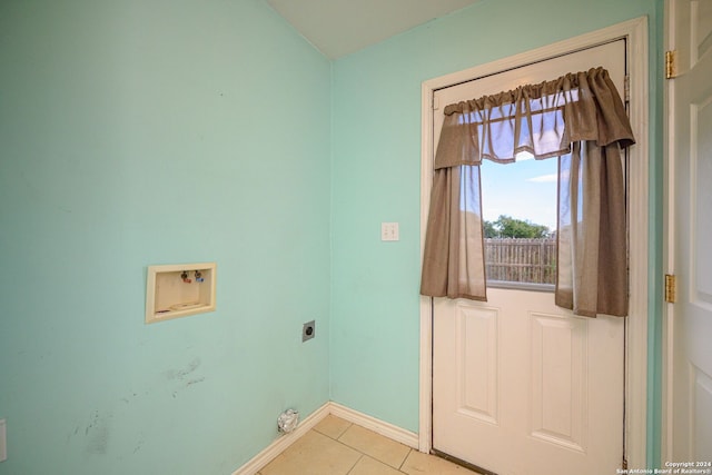 laundry room featuring light tile patterned floors, electric dryer hookup, and washer hookup