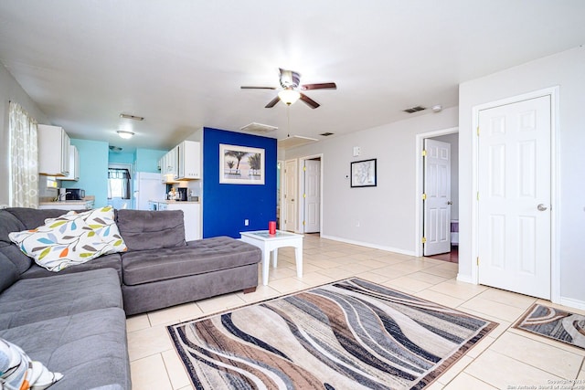 living room with ceiling fan and light tile patterned floors