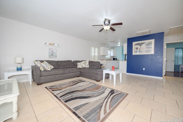 living room with ceiling fan and light tile patterned floors