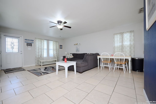 living room with ceiling fan and light tile patterned floors