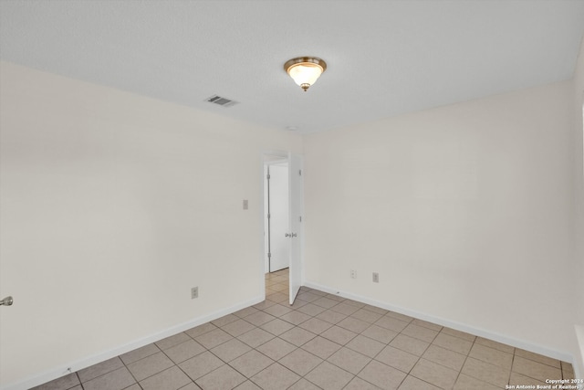 view of tiled spare room