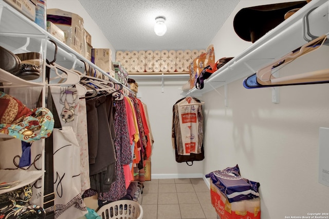 spacious closet featuring light tile patterned floors