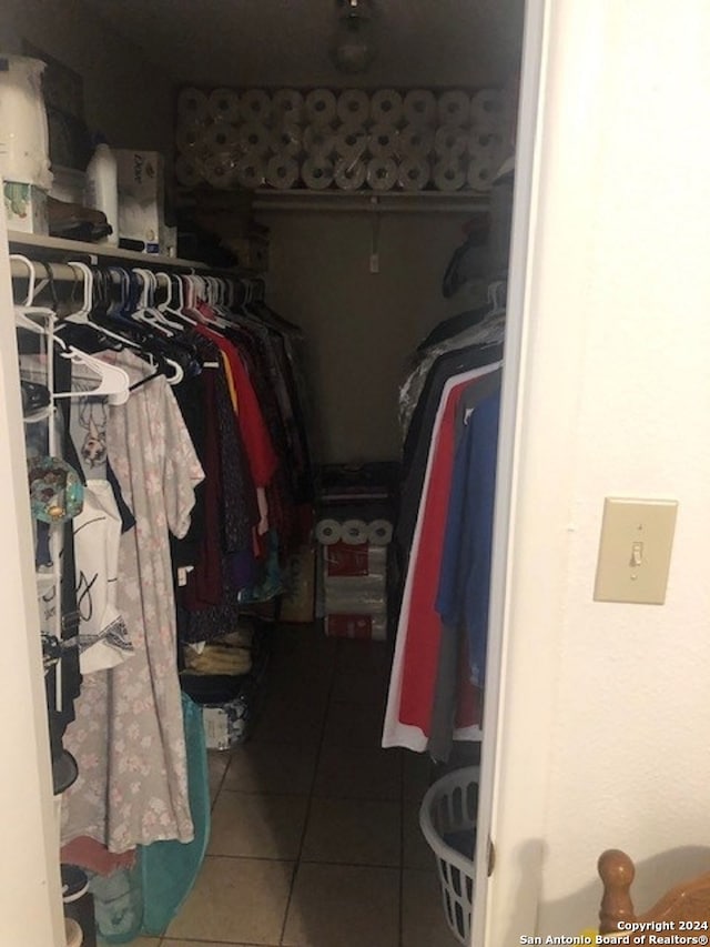 spacious closet featuring tile patterned floors