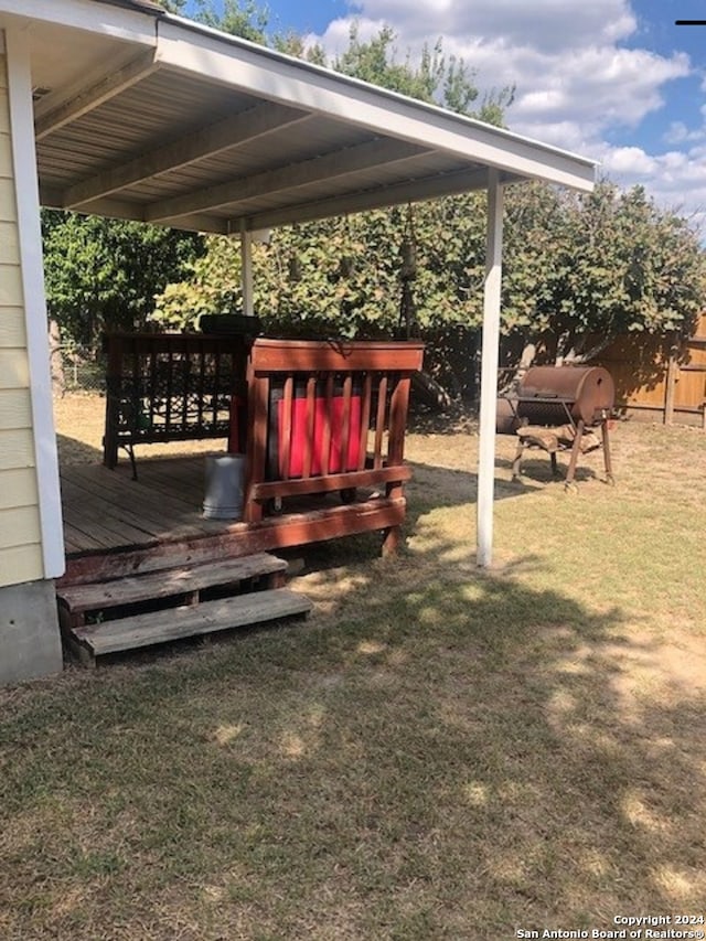 deck featuring a lawn