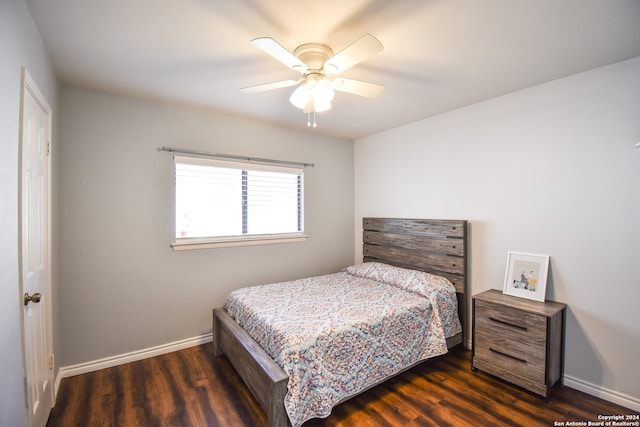 bedroom with ceiling fan and dark wood-type flooring