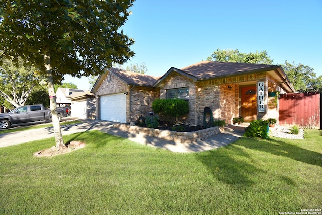 single story home with a front yard and a garage