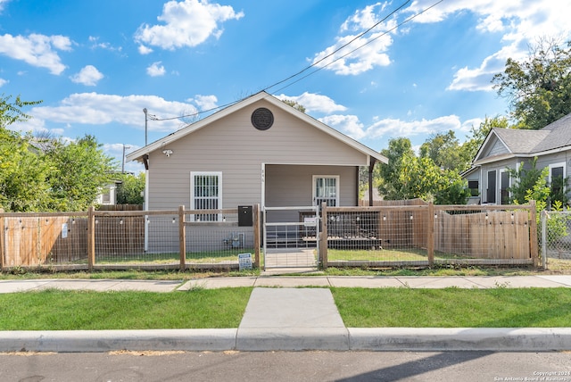 bungalow with a front lawn