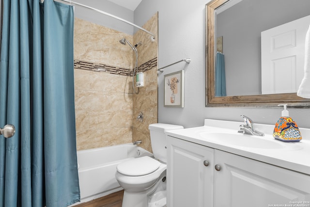 full bathroom with shower / tub combo with curtain, hardwood / wood-style flooring, vanity, and toilet