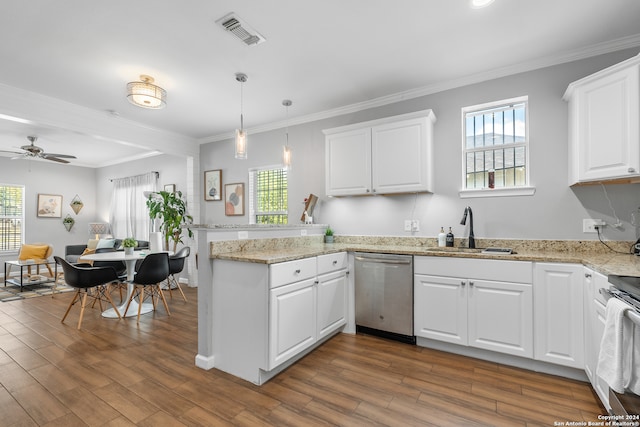 kitchen featuring appliances with stainless steel finishes, white cabinetry, and hardwood / wood-style floors