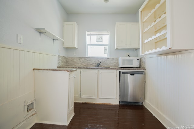 kitchen with white cabinetry, dishwasher, sink, and dark hardwood / wood-style flooring