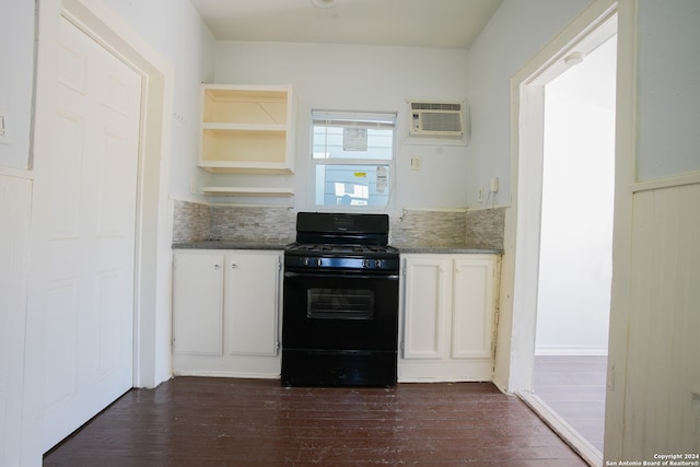 kitchen featuring white cabinetry, backsplash, a wall unit AC, black gas range, and dark hardwood / wood-style floors