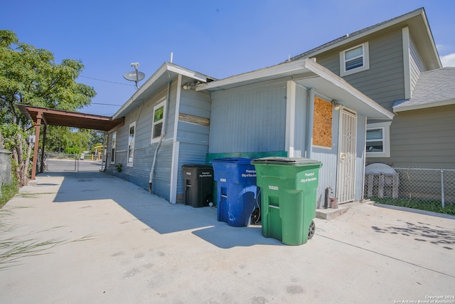 view of property exterior featuring a carport