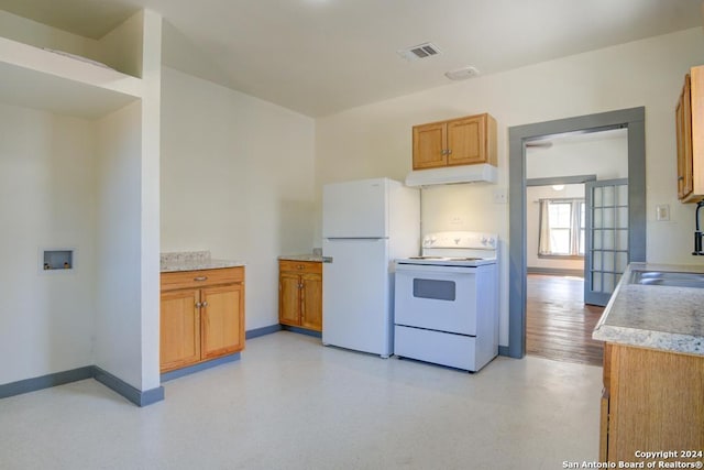 kitchen featuring sink and white appliances