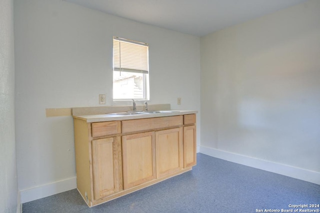 kitchen featuring sink and light brown cabinets