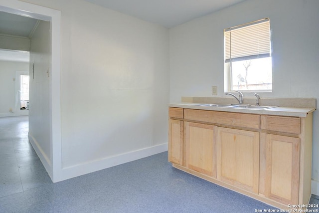 kitchen with light brown cabinets and sink