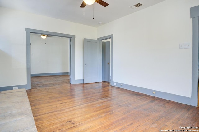 empty room featuring light hardwood / wood-style floors and ceiling fan