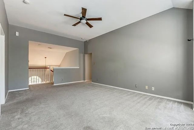 unfurnished living room with carpet floors, lofted ceiling, and ceiling fan