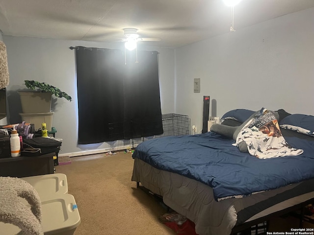 bedroom featuring ceiling fan and carpet floors