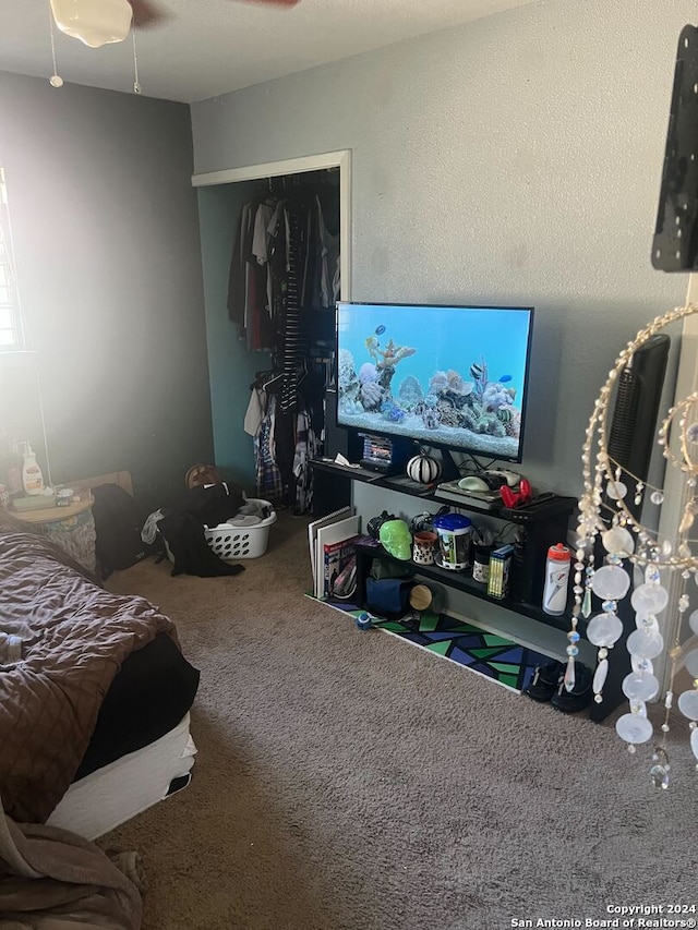 carpeted bedroom featuring ceiling fan