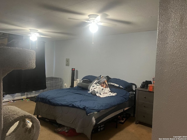 bedroom featuring ceiling fan and carpet floors