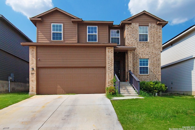 front of property featuring a front lawn and a garage