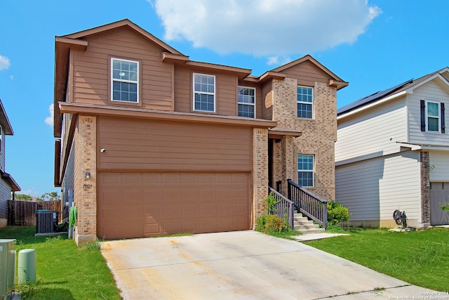 front facade featuring a garage and a front lawn