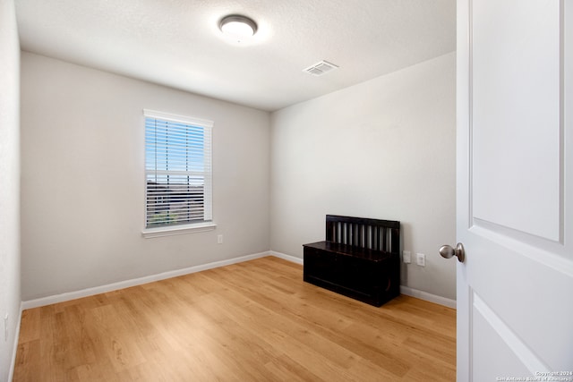 spare room with light hardwood / wood-style floors