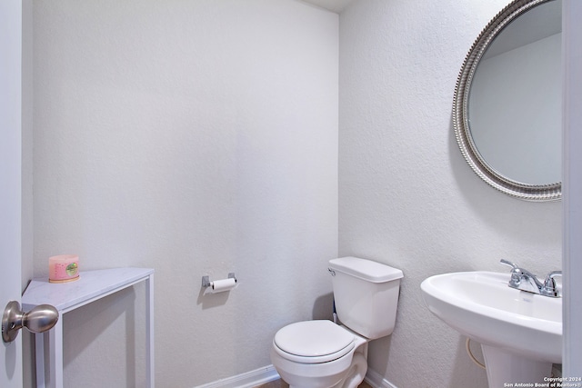 bathroom with sink and toilet