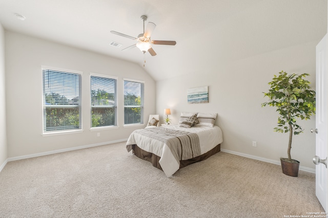 carpeted bedroom featuring ceiling fan and lofted ceiling