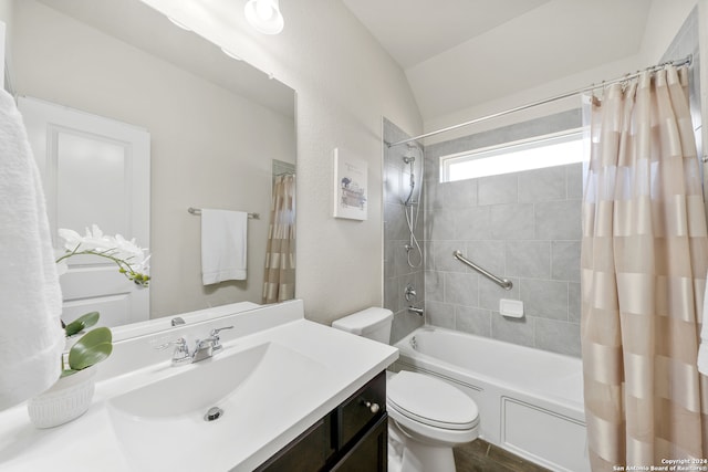 full bathroom featuring shower / bath combination with curtain, vanity, and toilet