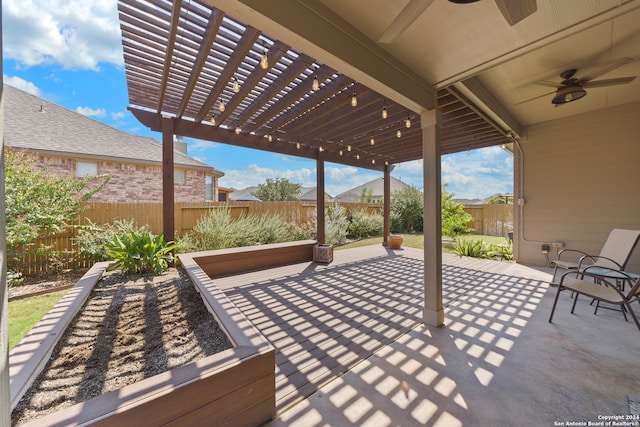 view of patio / terrace featuring a pergola and ceiling fan