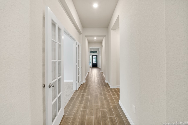 corridor featuring french doors