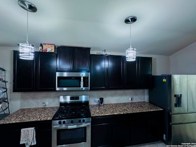 kitchen featuring stainless steel appliances, backsplash, hanging light fixtures, and stone countertops