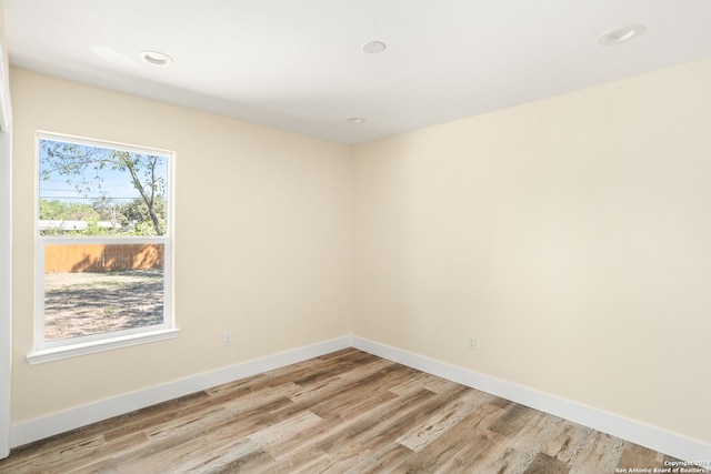 spare room featuring light hardwood / wood-style floors