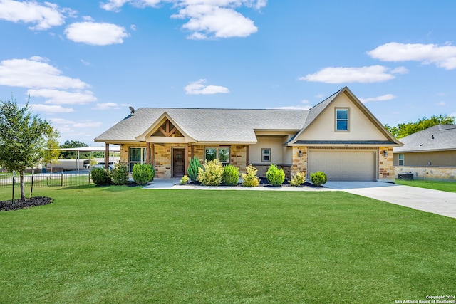 view of front facade with a front yard and a garage