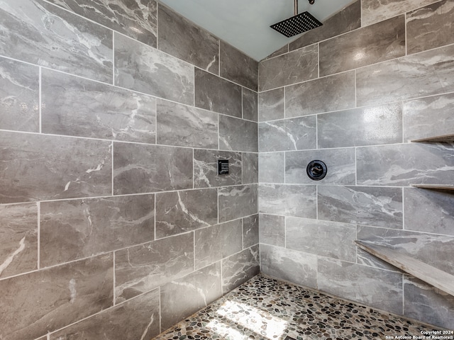 bathroom with tiled shower