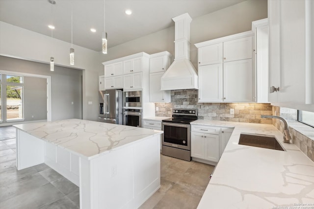 kitchen featuring a kitchen island, decorative light fixtures, stainless steel appliances, custom exhaust hood, and white cabinetry