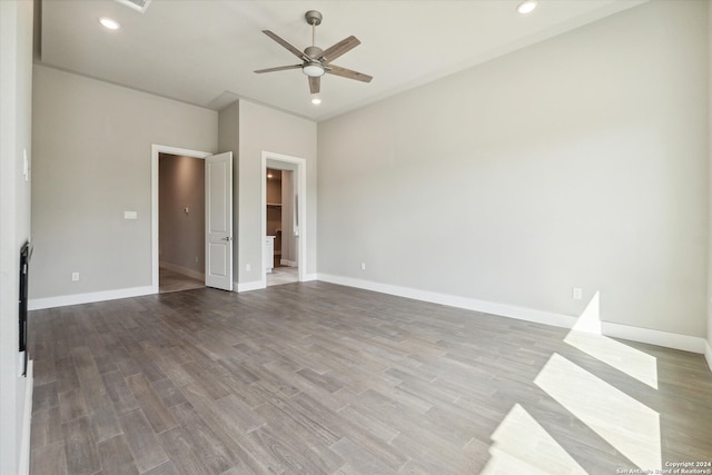 empty room with hardwood / wood-style flooring and ceiling fan