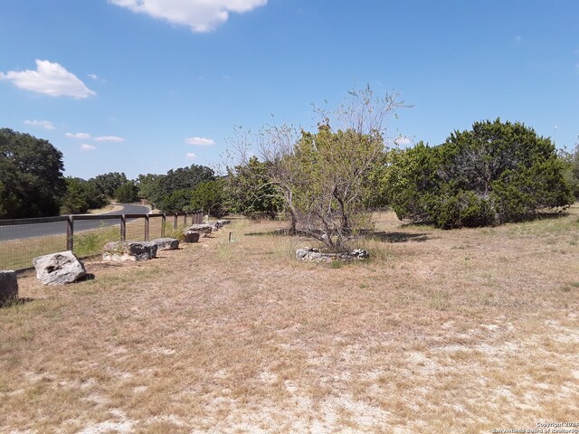 view of yard with a rural view