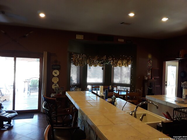 tiled dining area with sink