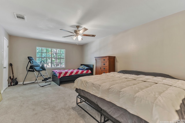 bedroom featuring ceiling fan and light colored carpet