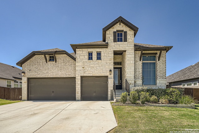 view of front facade featuring a front lawn and a garage