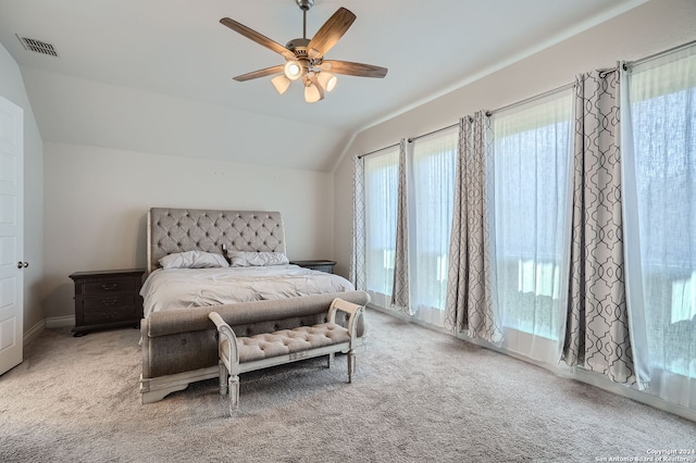 bedroom featuring ceiling fan, carpet flooring, and vaulted ceiling